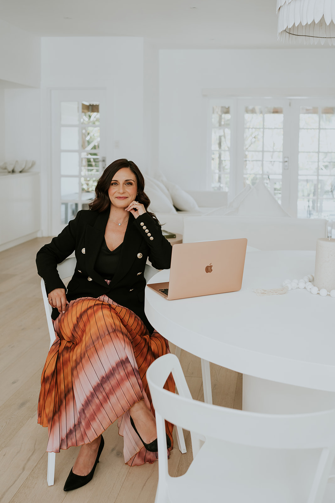 Doreen Brown, founder of Let's Get Visible, at her desk with her laptop